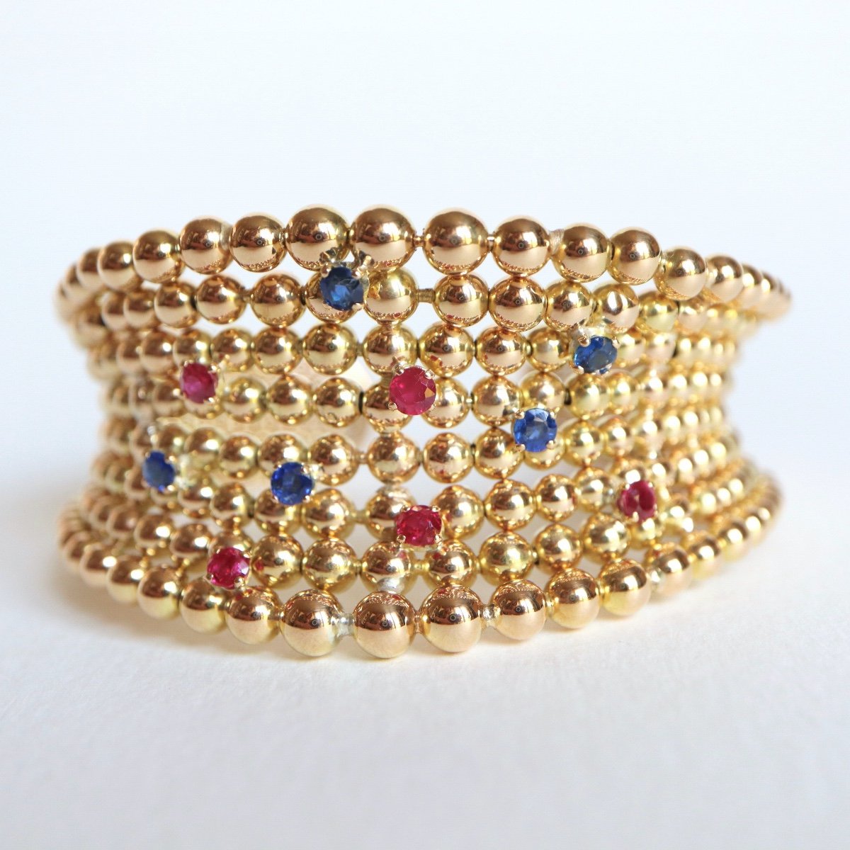 Boucheron Ravissant Bracelet en chute Huit rangs incurvés perles  Or Jaune 18 Carats Saphirs Et Rubis-photo-2