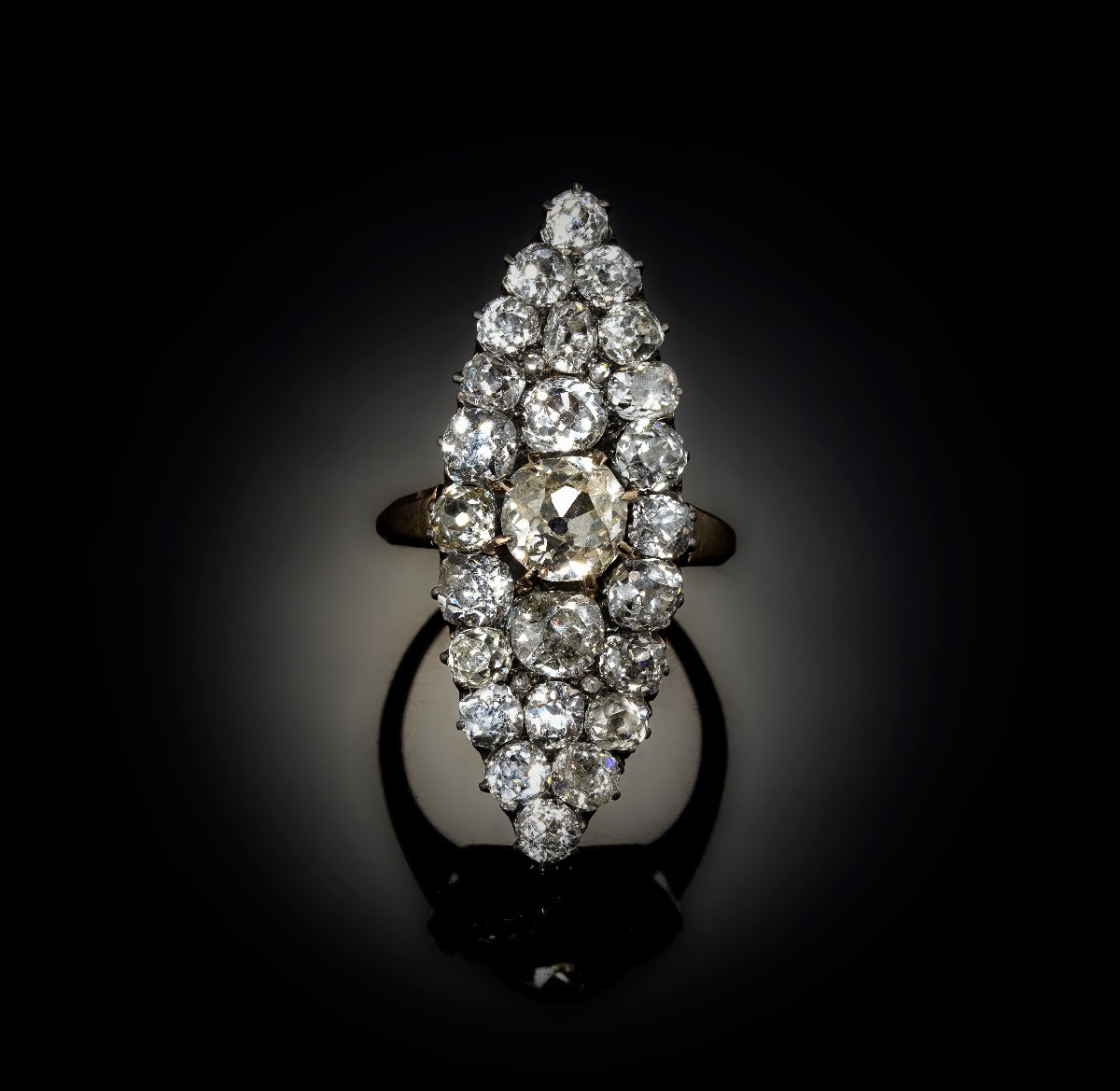 A Late 19th Century Navette Cluster Gold Ring With Diamonds.