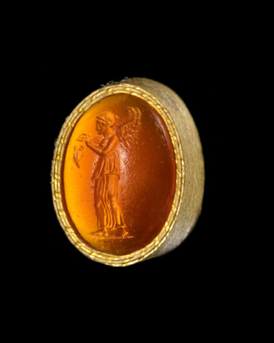 A Roman Republican Carnelian Intaglio. Nemesis With Butterfly.