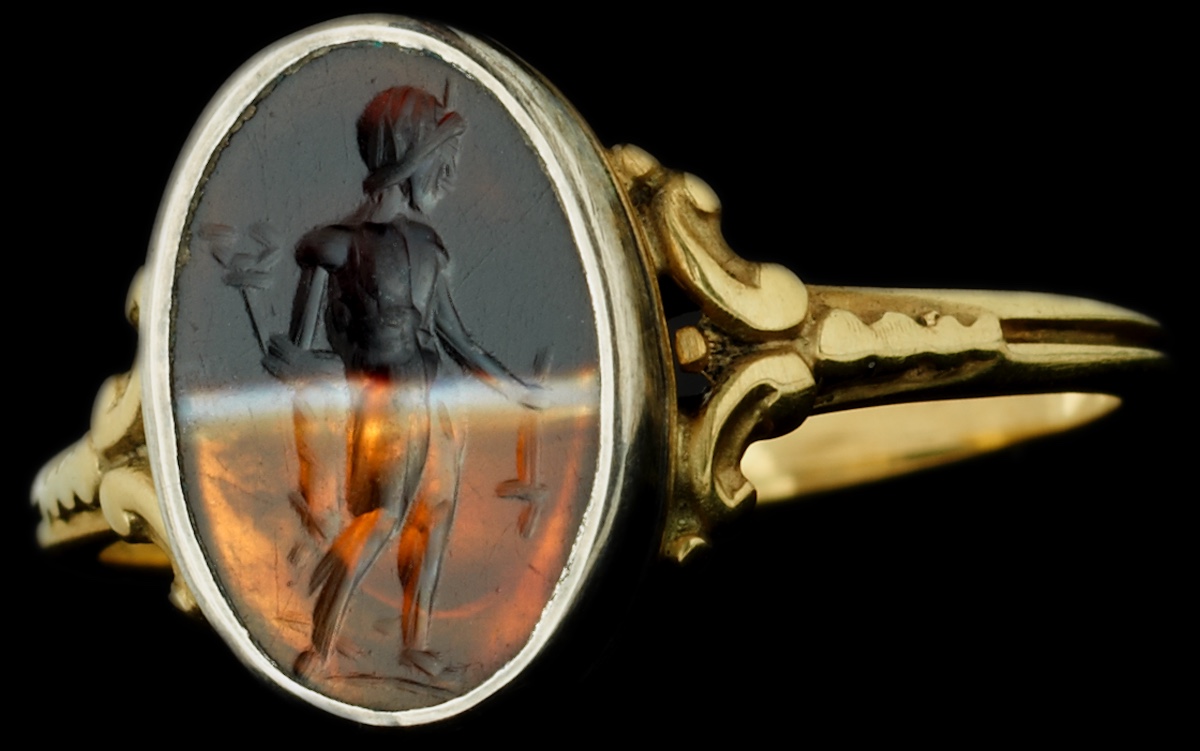 A Victorian Gold Ring Set With A Roman Banded Agate Intaglio. Mercury.