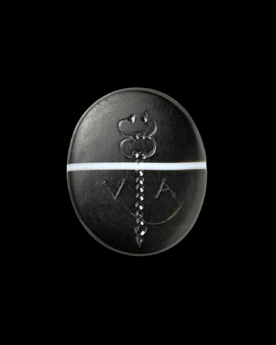 A Roman Republican banded agate intaglio. Caduceus with letters V · A