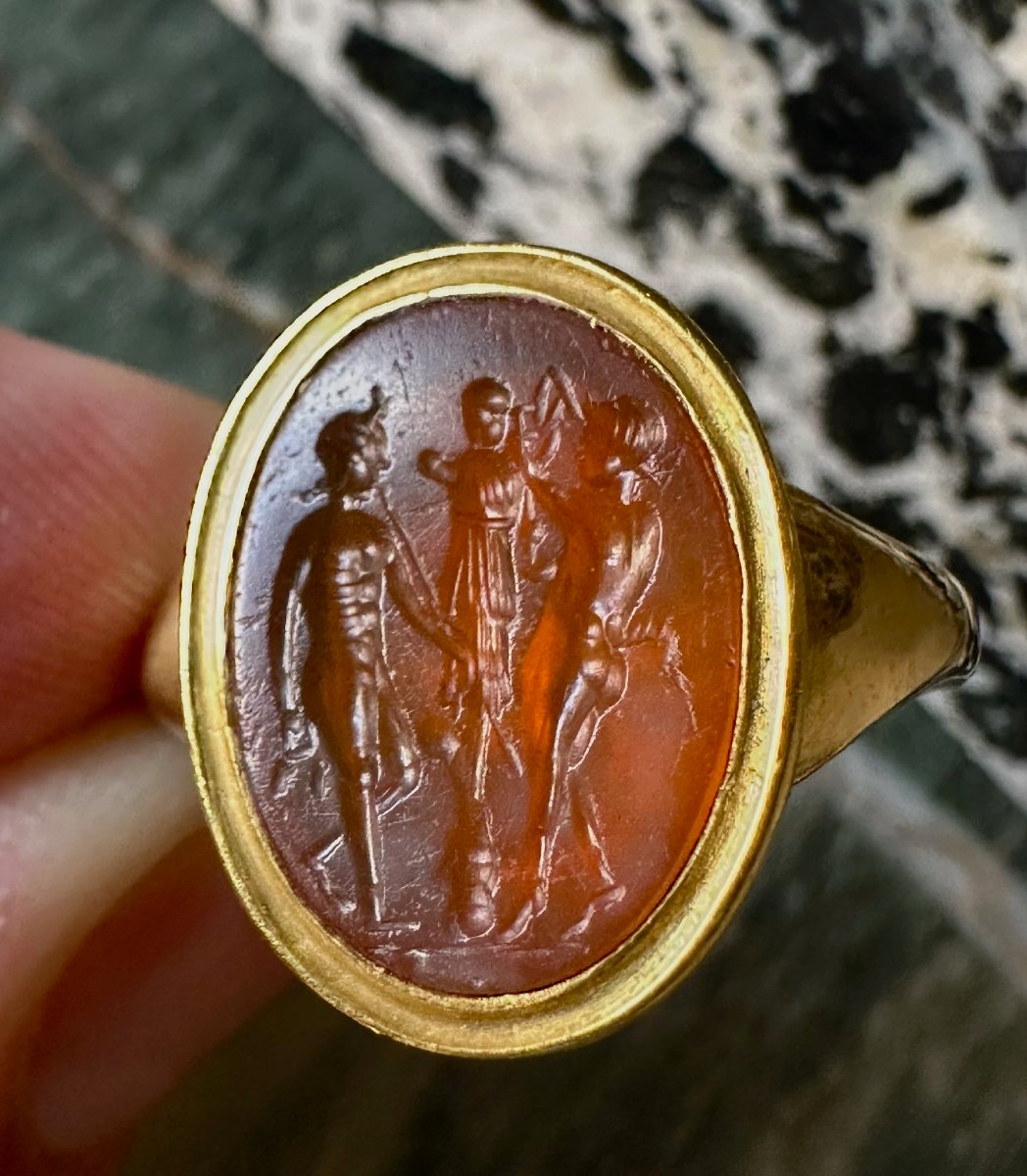 A Gold Ring Set With A Roman Carnelian Intaglio. Two Satyrs Crowning A Trophy.-photo-2
