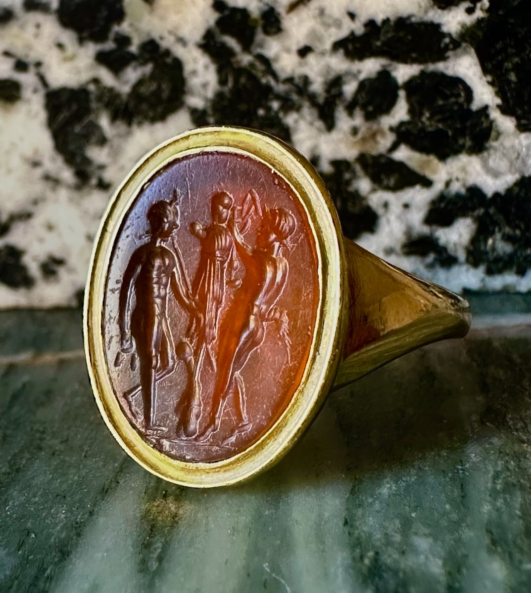 A Gold Ring Set With A Roman Carnelian Intaglio. Two Satyrs Crowning A Trophy.-photo-1