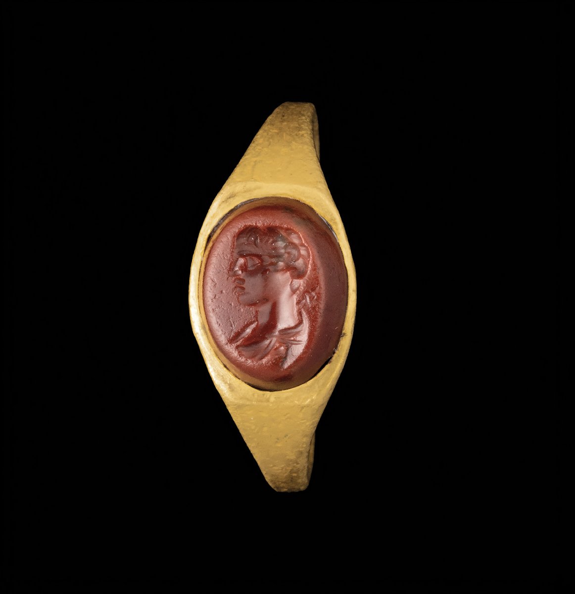 A Roman Gold Ring Set With A Red Jasper Intaglio Depicting The Bust Of Mercury.