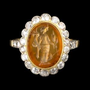 A Vintage Two Tone Gold Ring With Diamonds And Set With A Roman Carnelian Intaglio. Fortuna