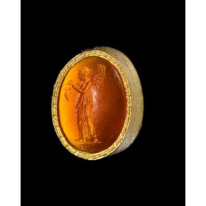 A Roman Republican Carnelian Intaglio. Nemesis With Butterfly.