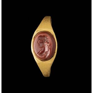 A Roman Gold Ring Set With A Red Jasper Intaglio Depicting The Bust Of Mercury.