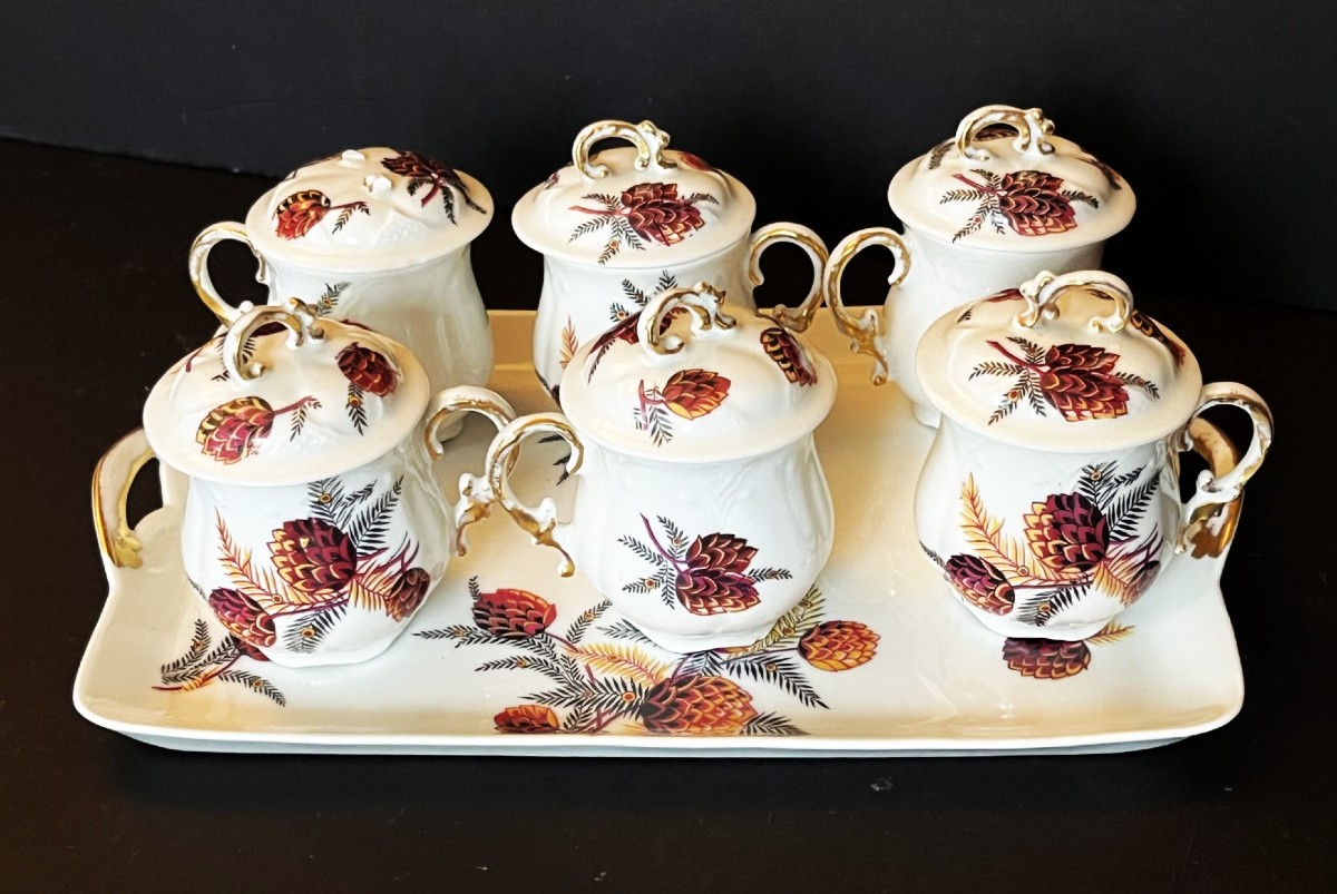 Six Limoges Porcelain Cream Pots Decorated With Pine Cones, With A Tray