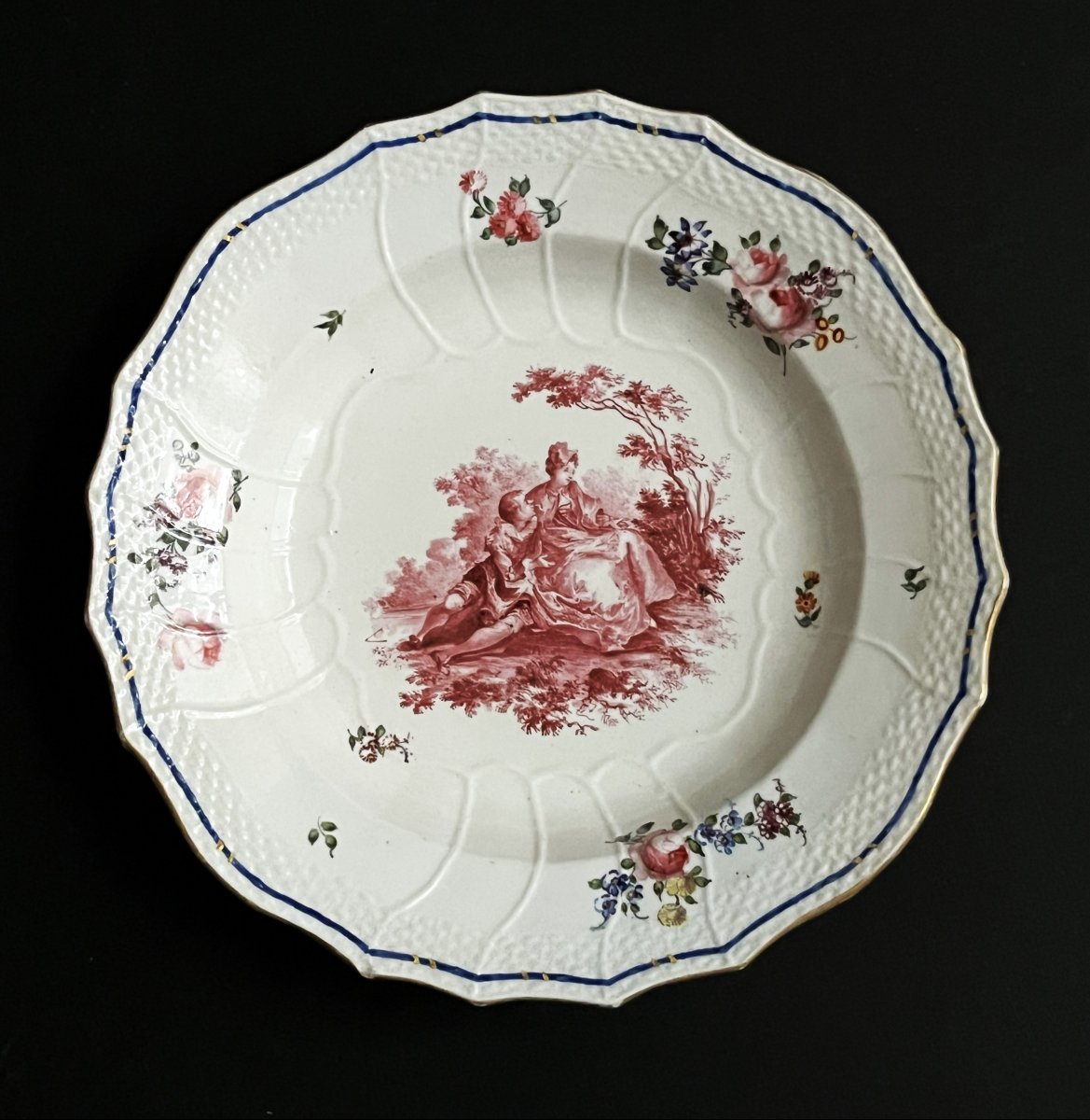 An 18th-century Sèvres Porcelain Soup Plate With A Pastoral Design.