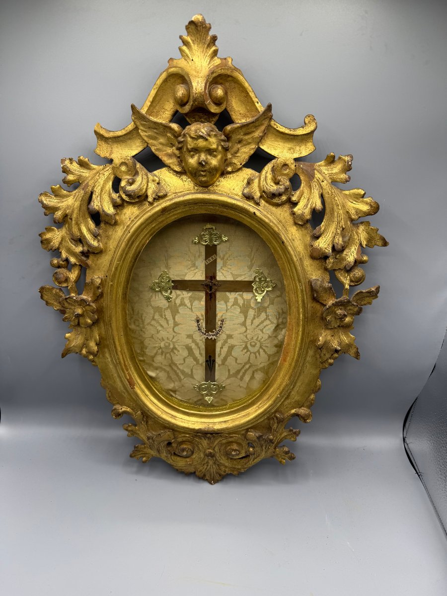 Relic Of The Holy Cross Of Our Lady Of The Holy Cross In An Oval, Carved, And Gilded Wooden Frame  