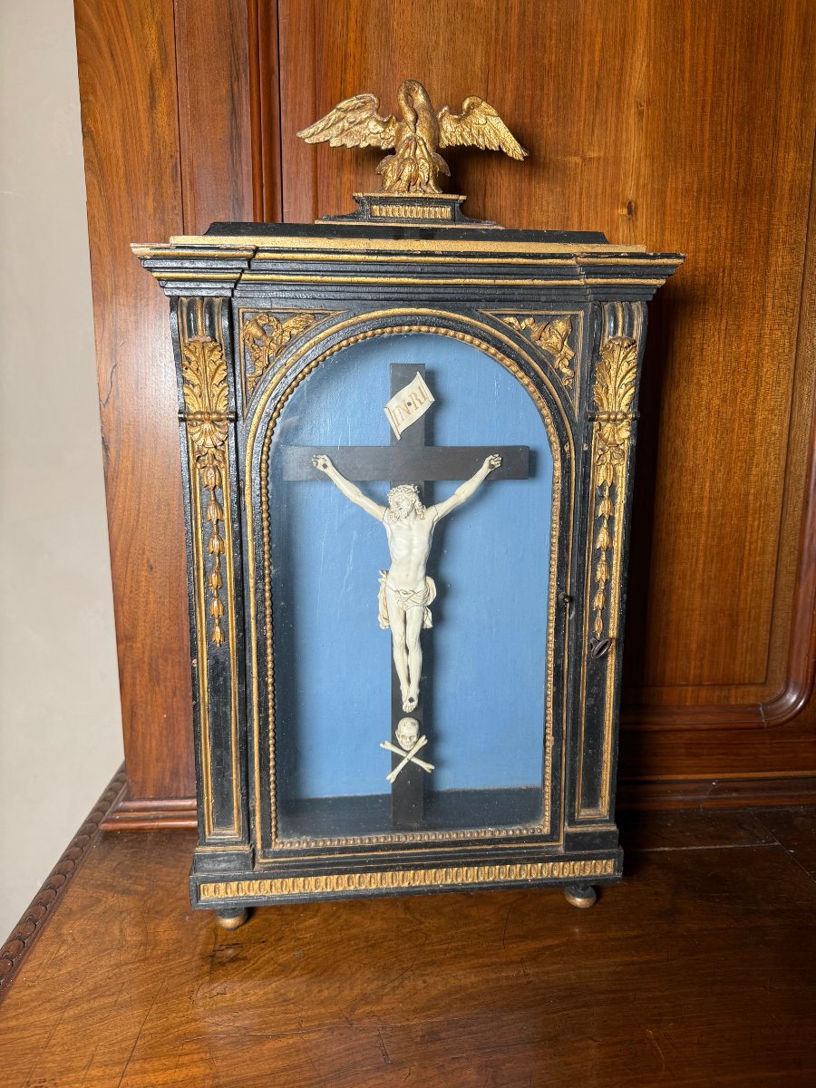 A Wooden Display Case Painted Ebony Black With Carvings In Pure Gold Depicting Christ In Ivory
