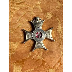 Staurothèque en argent doré en forme de croix grecque, contenant une relique de la Saint Croix