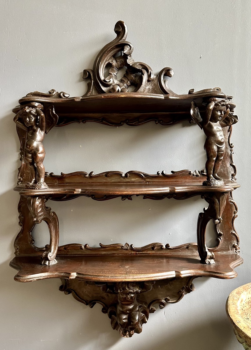 Wall-mounted étagère In Walnut, Carved With Cherubs – Louis Philippe. 