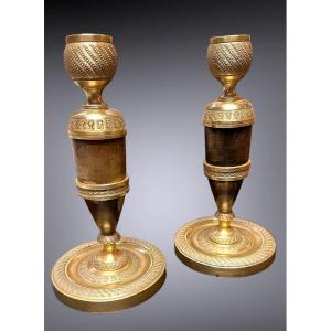 Pair Of Empire Candlesticks In Gilded And Dark Patinated Bronze