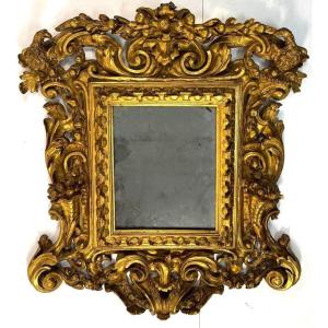Miroir en bois sculpté, gravé et doré, Toscane, début du XVIIIe siècle