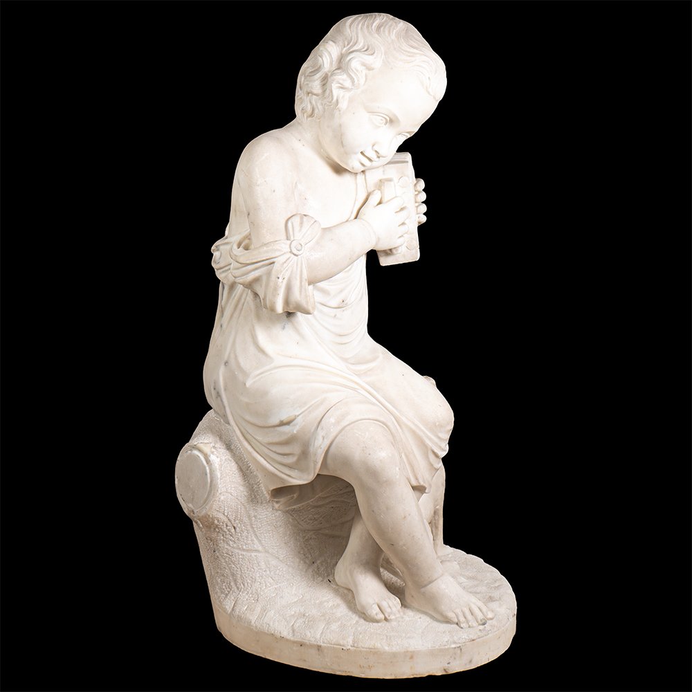 Sculpture en marbre représentant un garçon et son chien-photo-1