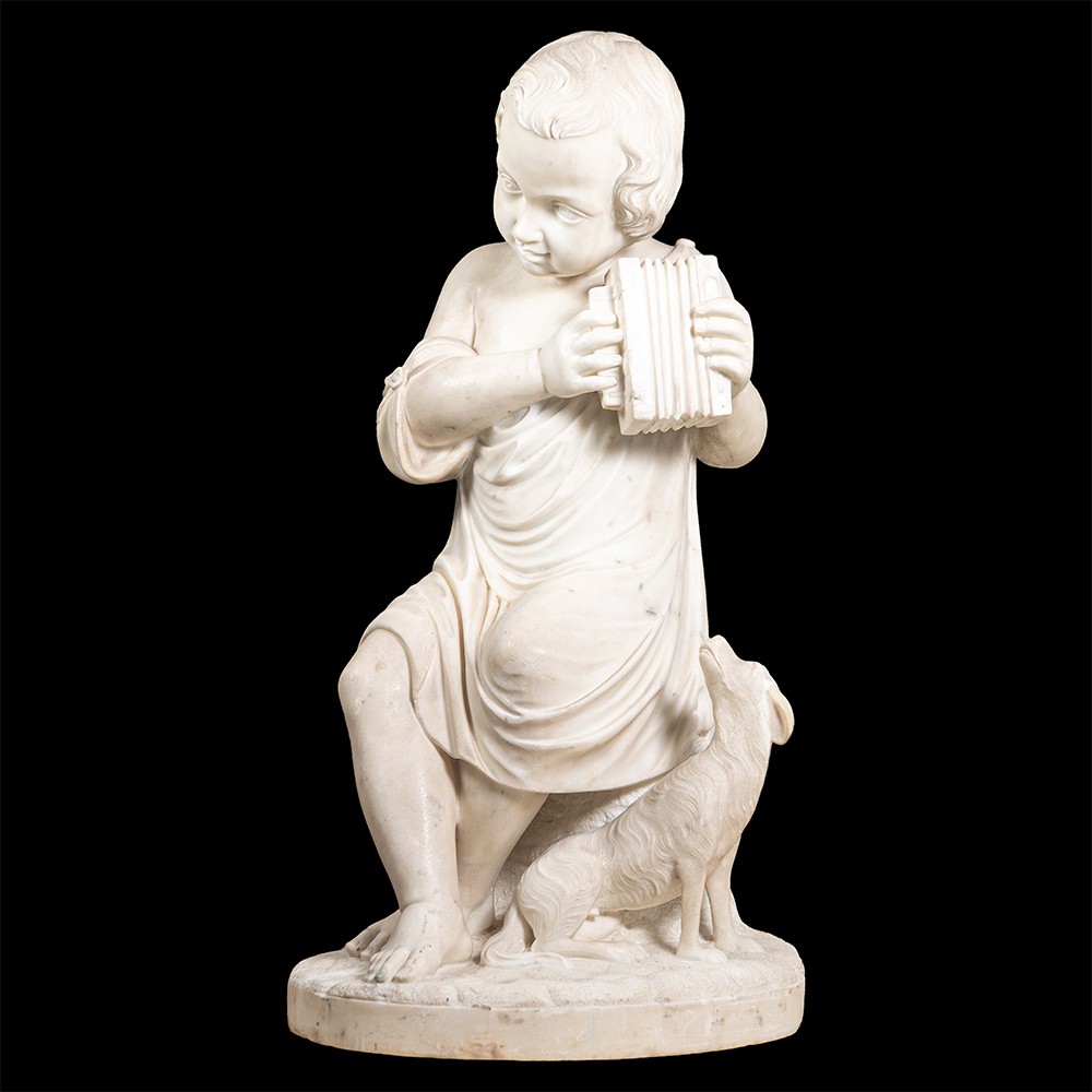 Sculpture en marbre représentant un garçon et son chien