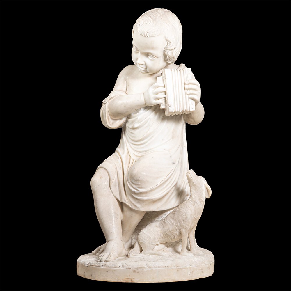 Sculpture en marbre représentant un garçon et son chien