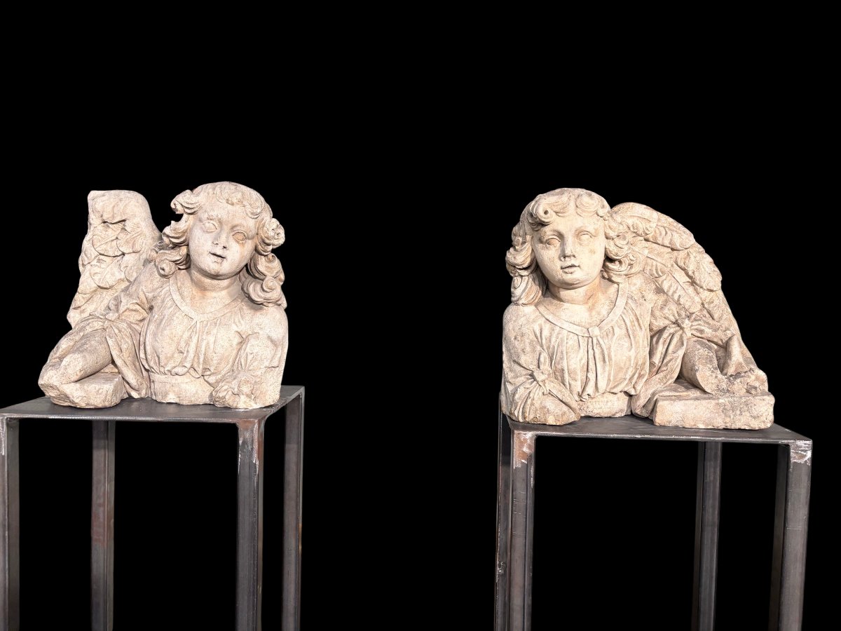 A Pair Of Stone Sculptures Depicting Angels