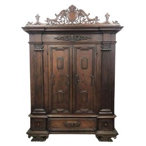 Walnut Wardrobe With Perforated Cymas And Coat Of Arms, With Lily Of The Farnese Family, Parma