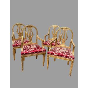 Four Carved And Gilded Wooden Armchairs
