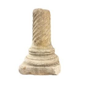 White Marble Column With Spiral Fluting And A Capital