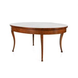 An Oval Veneered Table