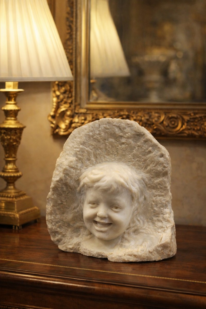 White Marble Sculpture Of A Child’s-photo-1