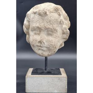 Tête de putto en pierre calcaire, sur base moderne