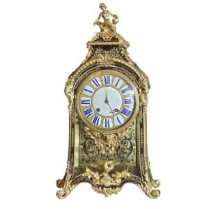 French Louis XV Cartel Pendulum Clock In Ebonized Wood And Gilded Bronze, 18th Century