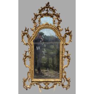 Grand miroir vénitien sculpté et doré de style rococo, fin XIXe – début XXe siècle