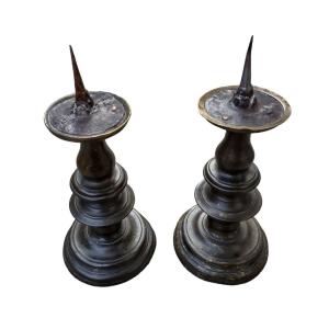 Pair Of High Period Candlesticks In Turned Bronze