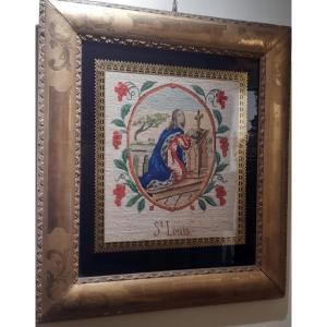 Broderie dans un cadre dorè