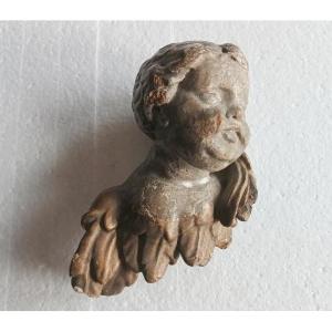 Tête d'ange en bois doré et argenté, XVIIIe siècle
