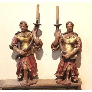 Antique Pair Of Polychrome Wooden Cherubs Holding A Candle, 17th Century