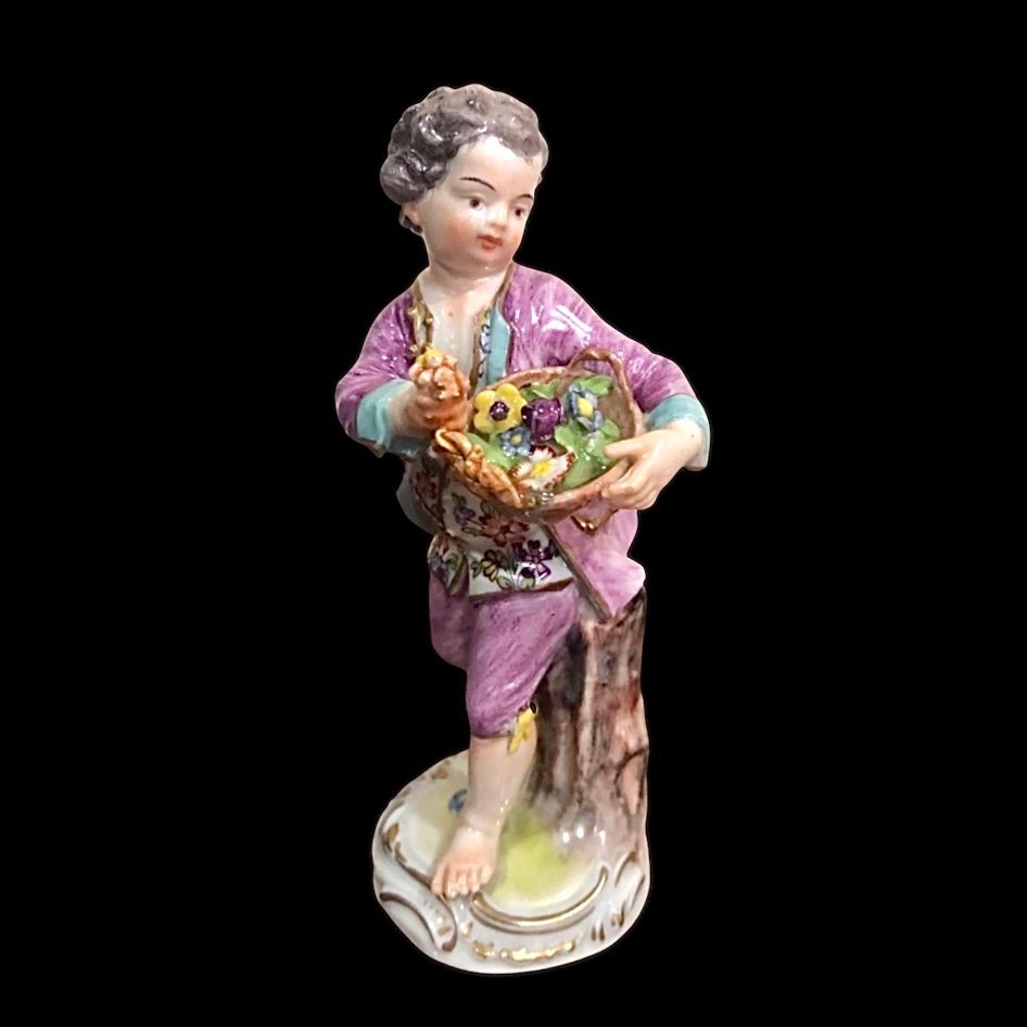 Figurine In Meissen Porcelain, Child With Basket Of Flowers. 