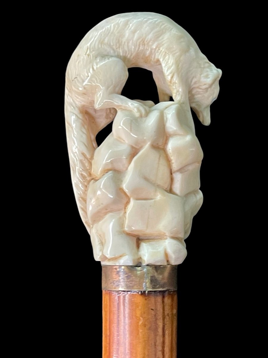 Stick With Ivory Knob Depicting A Wolf Hunting Prey Hidden In A Cave. -photo-1