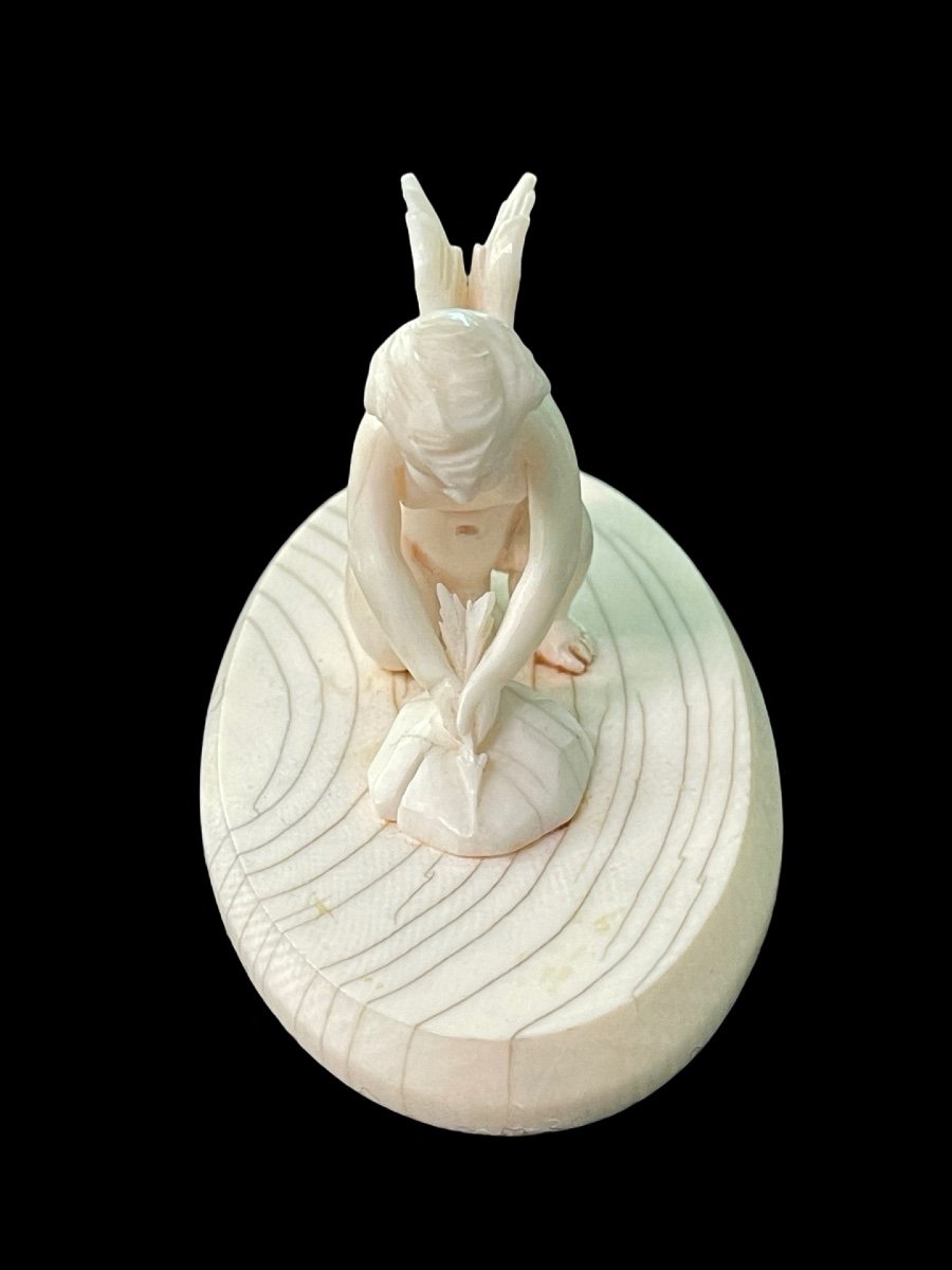 Small Ivory Sculpture Depicting Cupid Sharpening His Arrow. -photo-2