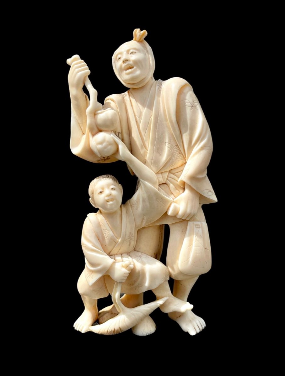 Ivory Okimono Sculpture With Male And Child Character. 