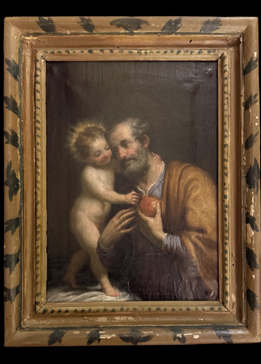 Peinture à l'huile sur toile représentant saint Joseph et l’énfant Jesus.