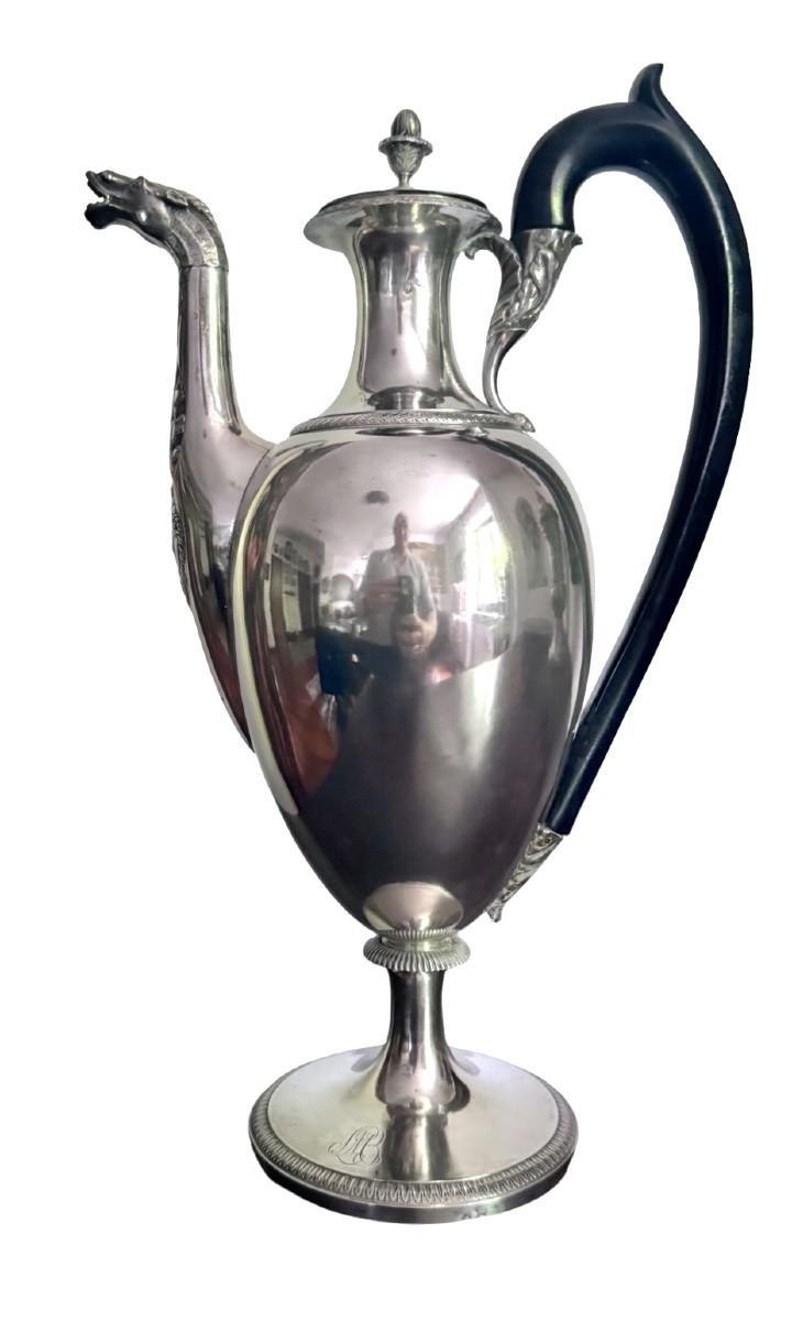 A Silver Coffee Pot With A Pear-shaped Body Resting On A Circular Base Adorned With Lanceolate Leaves.-photo-2