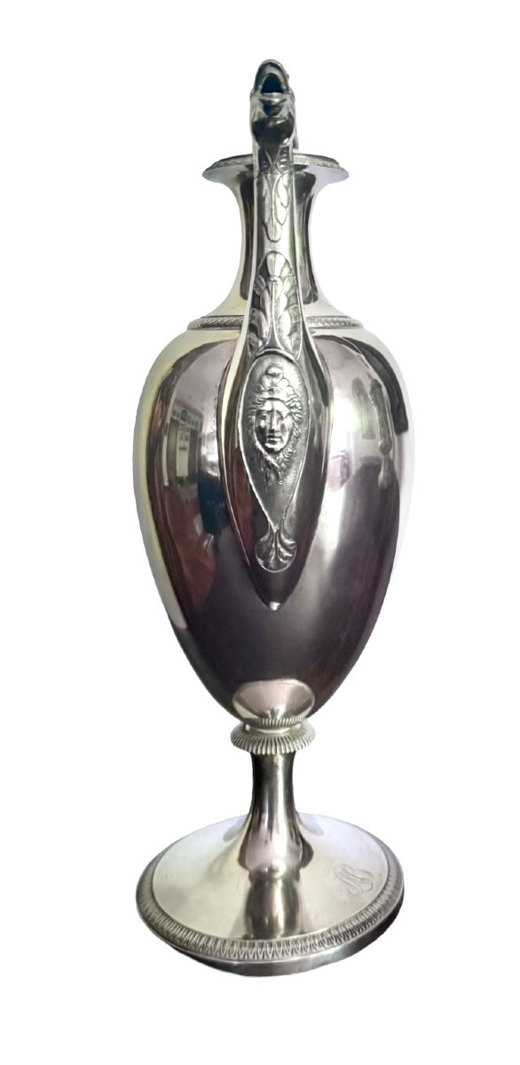 A Silver Coffee Pot With A Pear-shaped Body Resting On A Circular Base Adorned With Lanceolate Leaves.-photo-3
