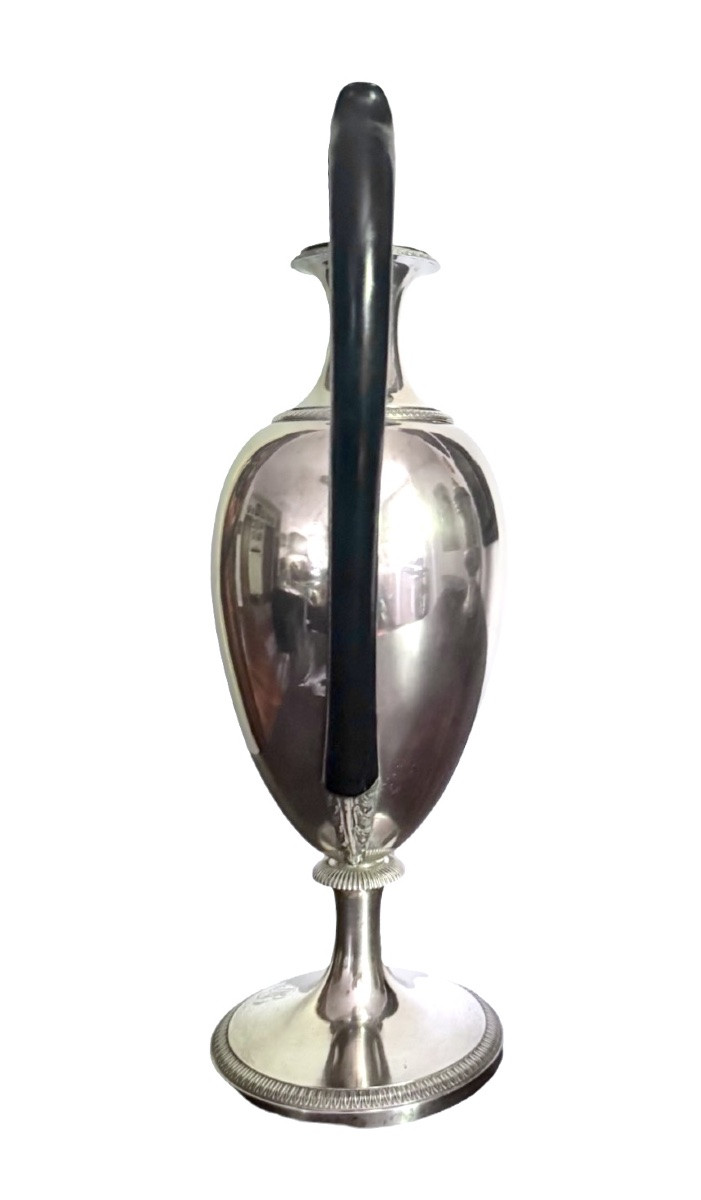 A Silver Coffee Pot With A Pear-shaped Body Resting On A Circular Base Adorned With Lanceolate Leaves.-photo-2