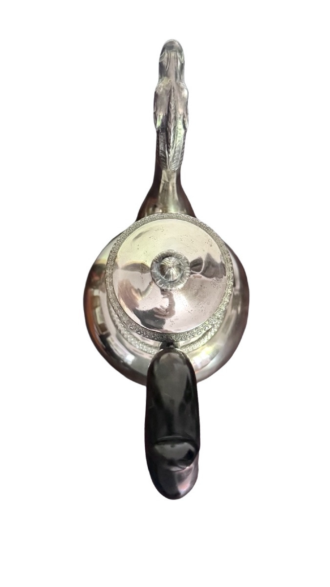 A Silver Coffee Pot With A Pear-shaped Body Resting On A Circular Base Adorned With Lanceolate Leaves.-photo-3