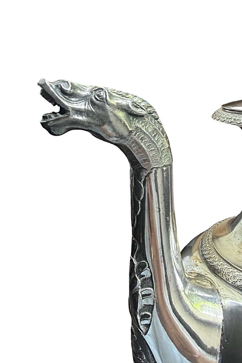 A Silver Coffee Pot With A Pear-shaped Body Resting On A Circular Base Adorned With Lanceolate Leaves.-photo-5