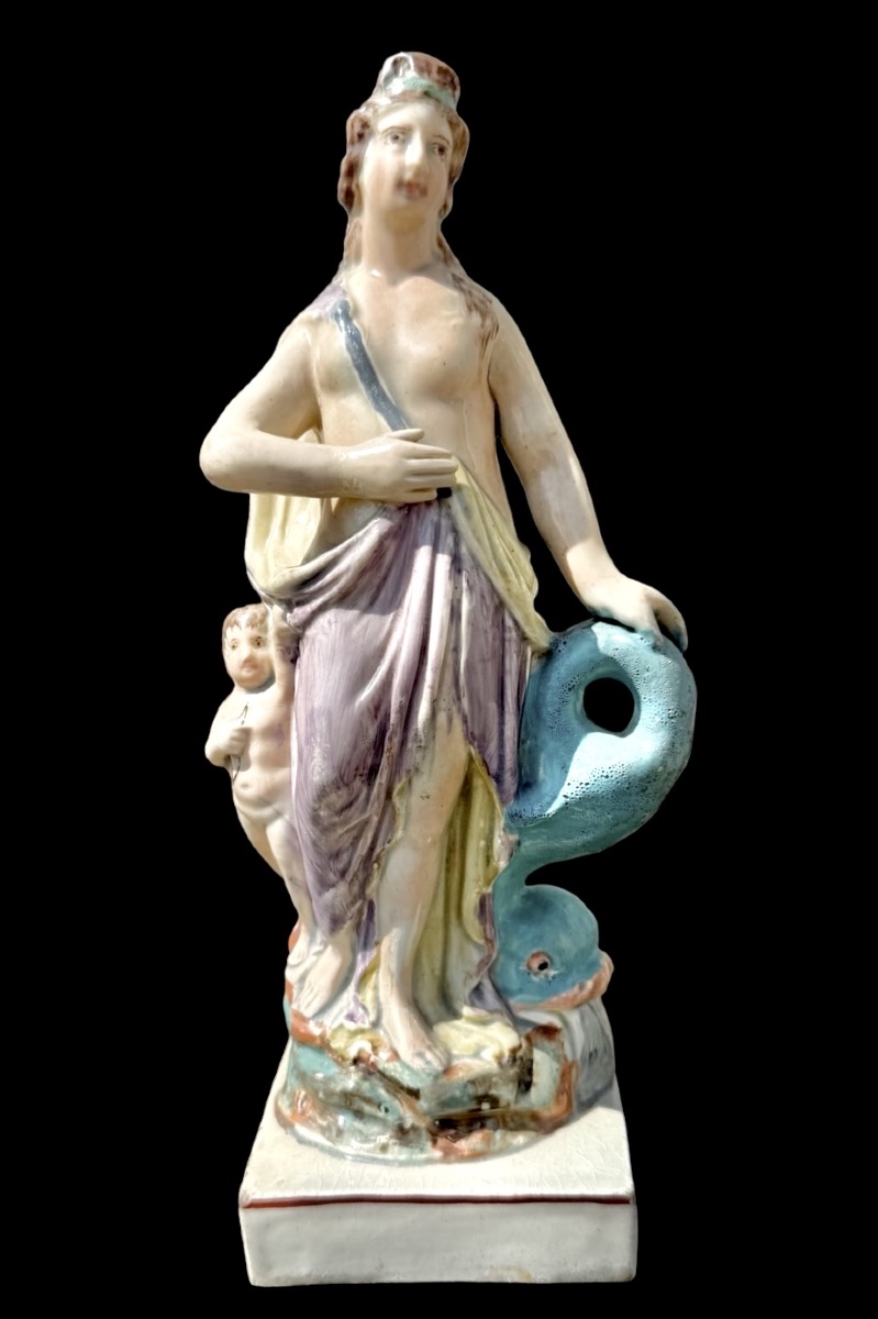 Polychrome Earthenware (pearlware) Figurine Of Venus With A Dolphin And A Cherub. England.