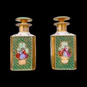 Pair Of Porcelain Perfume Bottles With Female Figures And Floral And Gold Decorations. France. 