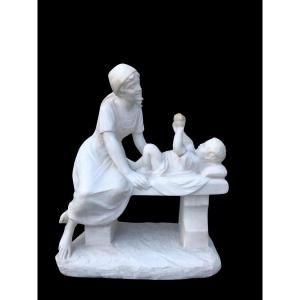 Sculpture In White Carrara Marble Depicting A Mother With Cherries In Her Mouth And Her Child. 