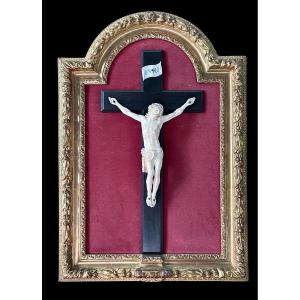 Christ In Ivory On An Ebony Cross And Shaped Frame In Gold Leaf. 