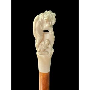 Stick With Ivory Knob Depicting Two Lions On A Rock Formation. 